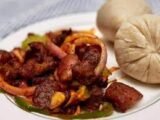 Banku with grilled chicken and hot pepper